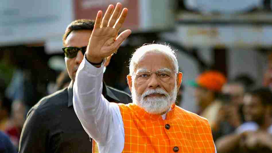 PM Modi addressing a huge crowd in Varanasi during his 50th visit."